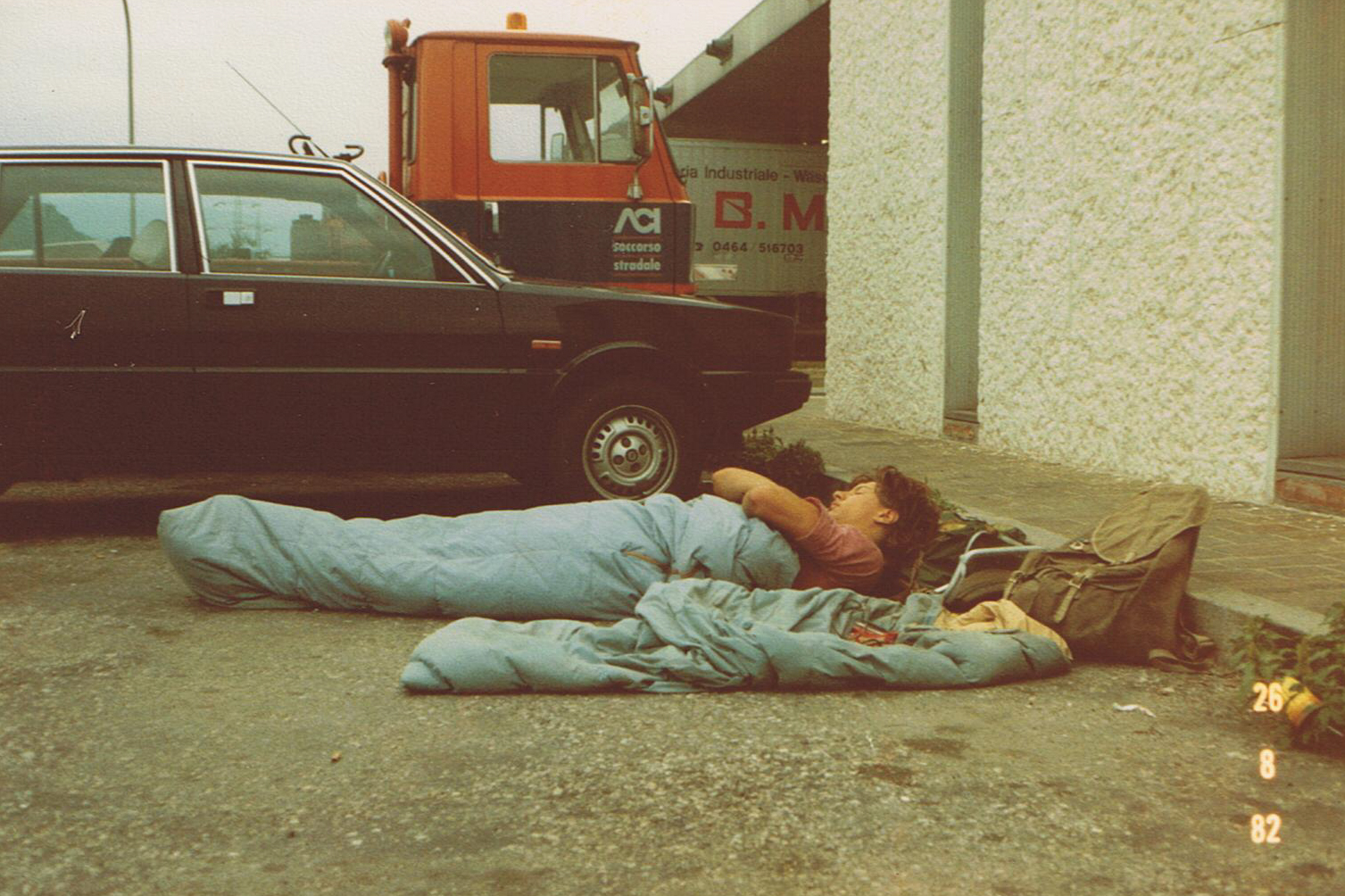 On the road, again... Chris asleep (?!) kipping rough - Italian border - 1982